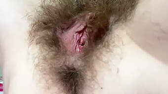 Intense Close-Up Of A Hairy Pussy Rubbing And Squirting